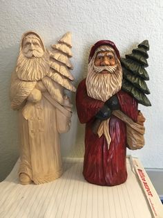 two gnome figurines sitting next to each other