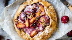 a pie with fruit toppings on top of it