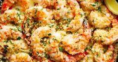 cooked shrimp with parmesan cheese and lemon wedges