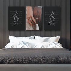 two black and white pictures on the wall above a bed