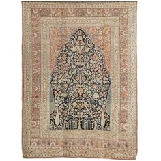 an antique persian rug with floral design