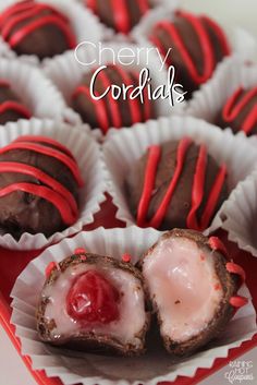 chocolate covered cherries in red and white paper wrappers on a plate with the word cherry cordials