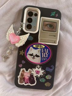 an iphone case with some stickers on it