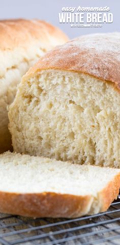 a loaf of white bread sitting on top of a cooling rack