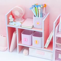 there is a pink shelf with many items on it