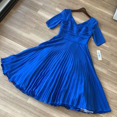 - Designer = Mikael Aghal - Size = 4. Trunk 70 - Msrp =$900 - Color = Royal Blue - Style = Pleated Flared Bottom Short Sleeve Size 4 Dress - Sleeve Length Measured At Seam Of Shoulder Blade To Bottom Tip Of Sleeve = 33cm - Length 4measured At Seam Of Shoulder Blade To Bottom Tip Of Dress = 114cm -Width Measured Across Chest From Seam Of Armpit To The Other = 47cm - Perfect Item For All Of Your Formal Events And Weddings. - Genuine And Authentic Or Your Money 5back Trunk 70 Elegant Royal Blue A-line Dress, Royal Blue A-line Fitted Dress, Blue Midi Dress With Pleated Back, Elegant Blue Pleated Midi Dress, Blue A-line Pleated Dress, Blue Evening Dress With Pleated Back, Elegant Blue Midi Pleated Dress, Blue Pleated Back Dress For Evening, Elegant Blue Midi Length Pleated Dress