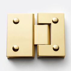 an image of two golden door handles on a white background