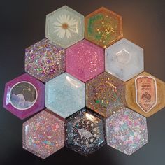 a bunch of hexagons that have glitter on them