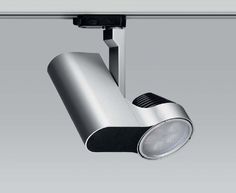 an overhead track light on a gray background