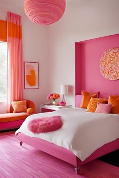 a bedroom with pink walls and orange accents