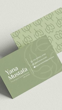 the business card is green and white