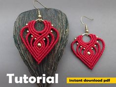 two pieces of red beaded earrings sitting on top of each other