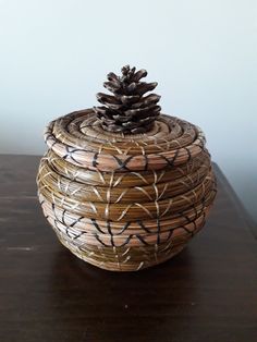 a pine cone sitting on top of a wooden table