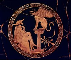 an ancient greek vase with two men and a monkey on it's side,