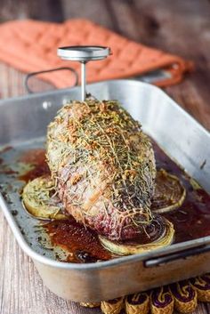 a roasting pan filled with meat and vegetables