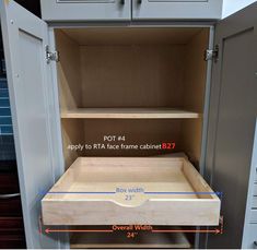 an open cabinet with measurements for the drawers