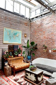 a living room with exposed brick walls and an american flag rug on the floor,