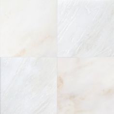 four different white marble tiles in three squares