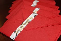 several red envelopes are lined up on a table