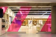 the interior of a library with red and white stripes