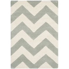 a rug with grey and white chevrons