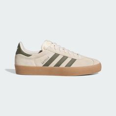 A skateboarding version of the classic adidas Gazelle sneakers, these shoes have higher foxing tape and a super grippy outsole. A double-layered toe adds durability, while a molded sockliner offers an elevated fit. Sneakers 2024 Fall, Women’s Adidas Sneakers, Neutral Adidas Shoes, Cute Adidas Shoes Women, Mens Shoes 2024 Trends, Popular Adidas Shoes, Shoes With Dresses, Adidas Gazelle Green, Beige Adidas