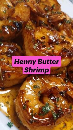 a close up of food on a plate with the words henry butter shrimp over it