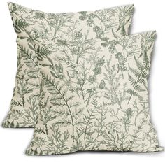 two pillows with green plants on them