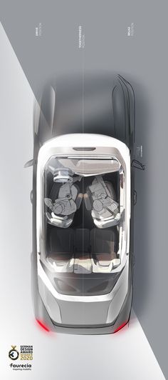 an overhead view of the front end of a car with its lights on and seats folded down