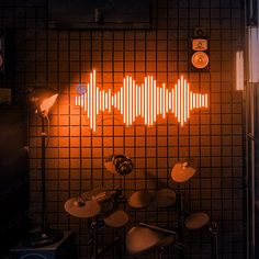 an image of sound waves on the wall in a recording studio with drums and microphones