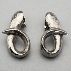 Features: - 100% Authentic ALEXIS LAHELLEC. - Massive modernist silver earrings. - Silver tone hardware. - Signed ALEXIS LAHELLEC. - Clip back earrings. - Minor oxidation. - Very good vintage condition. Measurements: Height: 2.12 inches (5.4 cm) Width: 1.06 inches (2.7 cm) Weight per Earring: 11 grams * These earrings will be shipped via DHL Express Shipping with tracking number. Please convo me for any queries and additional photos. Thank you for visiting. Other Fees that buyers need to know: P Contemporary Silver Evening Earrings, Contemporary Silver Earrings For Evening, Silver Modernist Earrings For Formal Occasions, Modernist Silver Pierced Earrings, Silver Modernist Earrings, Contemporary Oxidized Metal Earrings, Unique Silver Earrings For Evening, Contemporary Silver Earrings With Oxidized Finish, Modern Silver Plug Earrings For Formal Occasions