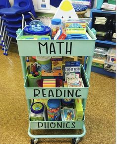 a green cart filled with books and toys