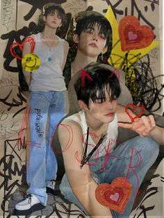 two young men sitting next to each other in front of graffiti covered wall with hearts on them