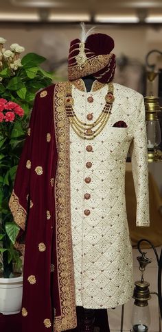 Step into elegance and tradition with our Alluring White Sherwani, a stunning choice for the discerning groom. This designer sherwani blends classic charm with contemporary style, perfect for a memorable wedding day look. Handcrafted with meticulous attention to detail, this sherwani features intricate embroidery and exquisite embellishments, making it a standout piece for any groom. Elevate your wedding attire with this magnificent sherwani, tailored to perfection for a truly regal appearance o White Wedding Sherwani For Groom, Groom Outfits Wedding, Indian Groom Dress, Indian Wedding Clothes For Men, Nikah Outfit, Sherwani For Men Wedding