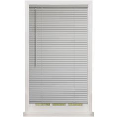 a white window blind with the blinds closed