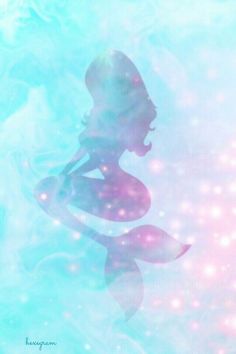 the silhouette of a mermaid in blue and pink water with bubbles on it's back