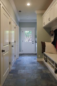 the hallway is clean and ready to be used as a mudroom or office space