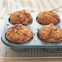 some muffins are sitting on a cooling rack