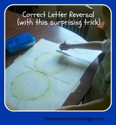 a child is drawing on paper with scissors