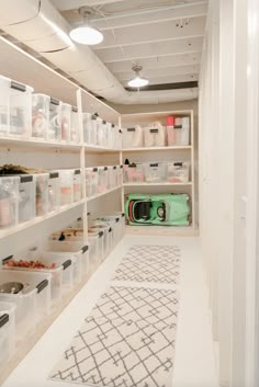 a room filled with lots of shelves and bins