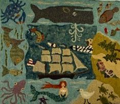 a rug with an ocean scene on the front and bottom, along with other sea creatures