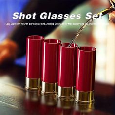 the shot glasses set is red and gold, with four shots in each one being filled