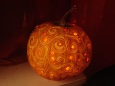 a carved pumpkin sitting on top of a table