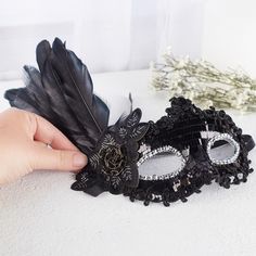 Black Feathered disguise. Whether for Halloween or a fancy masquerade this Black Feathered disguise will be give you that classy look.    The detailing of the disguises complements a costume or plain dress for a simple-yet-charming disguise. The attached feathered accent, along with rose offer a dramatic look.    One size fits most Elegant Halloween Costume Eye Mask, Elegant Halloween Eye Mask, Elegant Eye Mask For Halloween, Halloween Eye Mask For Costume, Halloween Eye Masquerade Mask, Halloween Eye Mask For Costume Party, Halloween Masquerade Eye Mask, Halloween Costume Party Eye Mask, Black Costume Accessories For Halloween Carnival