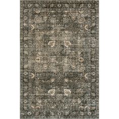 an area rug with various colors and patterns on the floor, including black, gray, beige