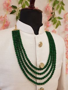 Elevate your sherwani with this timeless Emerald Groom Necklace, an exquisite piece of Indian groom jewelry. This stunning mala is designed to perfectly complement your sherwani, adding a sophisticated and regal touch to your look. Crafted with intricate detailing and high-quality materials, this groom wedding necklace is the ideal accessory for making a memorable impression on your special day. Elevate your sherwani with this timeless piece and embody the grace and tradition of Indian weddings. Color Disclaimer: While we make every effort to display the colors accurately, please note that actual colors may vary slightly due to your display settings and photography lighting. If you have any queries about this product, do not hesitate to ask us. Just give us a message and we will be happy t Beads Jewellery, Emerald Necklace, Green Necklace