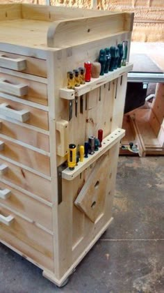 a wooden workbench with many tools on it