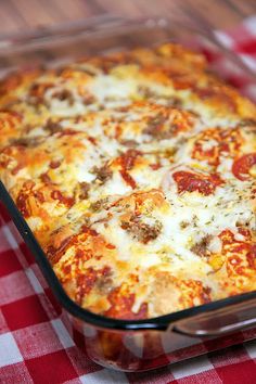 a square casserole dish on a red and white checkered tablecloth,