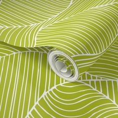 a green and white wallpaper with wavy lines