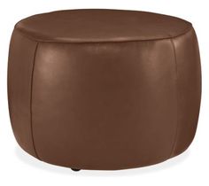 a brown leather ottoman with wheels